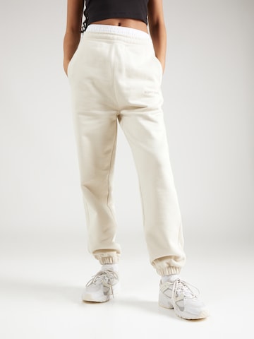 Tommy Jeans Tapered Bukser 'CLASSICS' i beige: forside