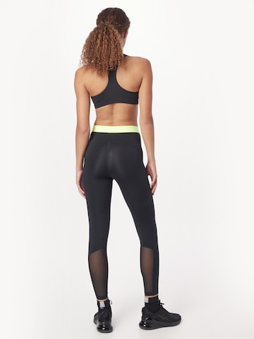 NIKE Skinny Sporthose in Schwarz