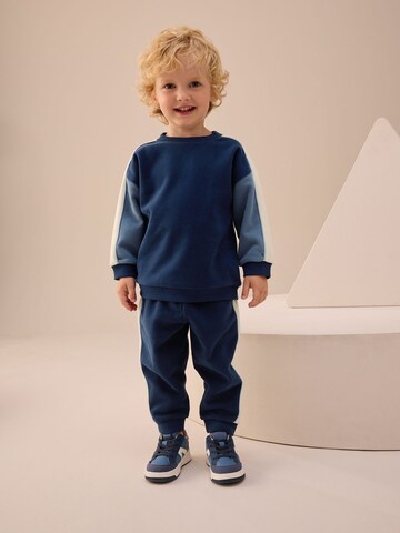 Next - Ropa para correr en azul: frente