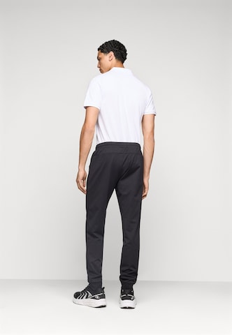 Tapered Pantaloni sportivi 'FNK' di 4F in nero