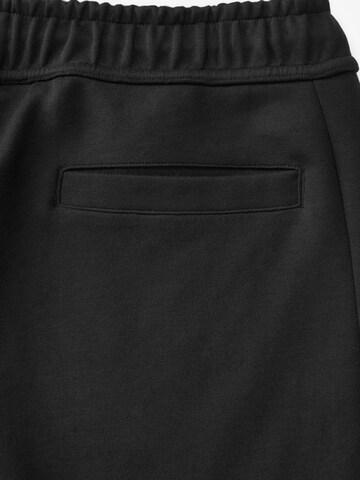 Tapered Pantaloni funzionali di Next in nero
