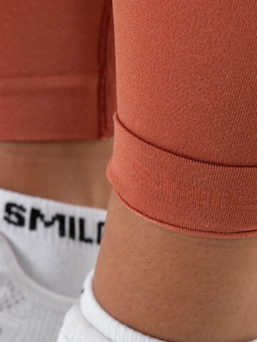 Skinny Pantalon de sport 'Amaze Pro' Smilodox en orange