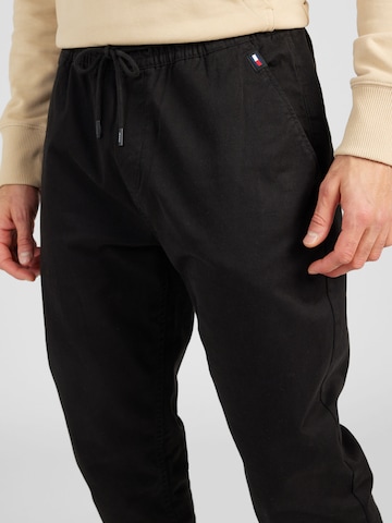 Tommy Jeans Zwężany krój Spodnie 'AUSTIN' w kolorze czarny