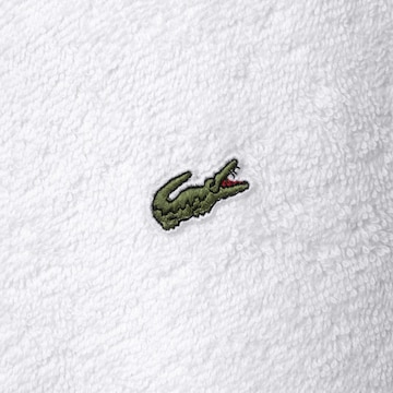 Serviette de douche LACOSTE en blanc