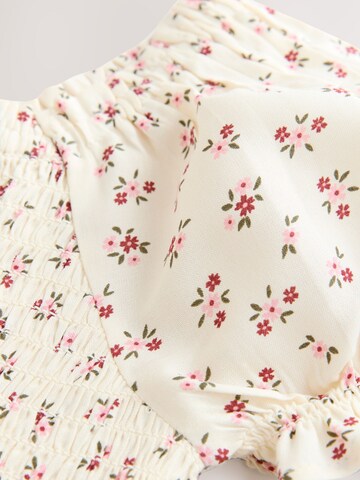 Tuta di Next in beige