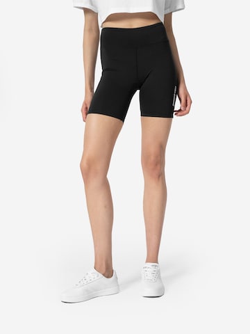 4F Slim fit Sports trousers in Black: front