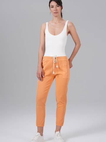 M.O.D MIRACLE OF DENIM Baggy Jeans in Orange: front