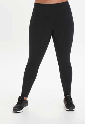 Q by Endurance Skinny Funktionstights in Schwarz: Vorderseite