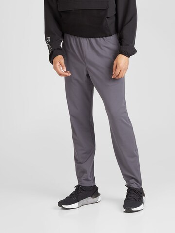 Regular Pantalon de sport UNDER ARMOUR en gris : devant