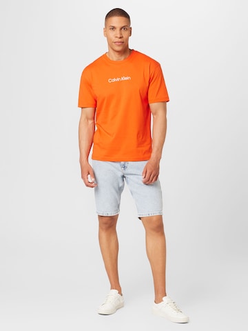 Calvin Klein - Camisa 'Hero' em laranja