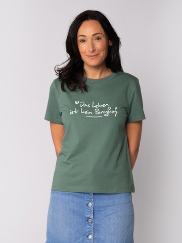 Maglietta 'Das Leben Ist Kein Ponyhof' di Watapparel in verde: frontale