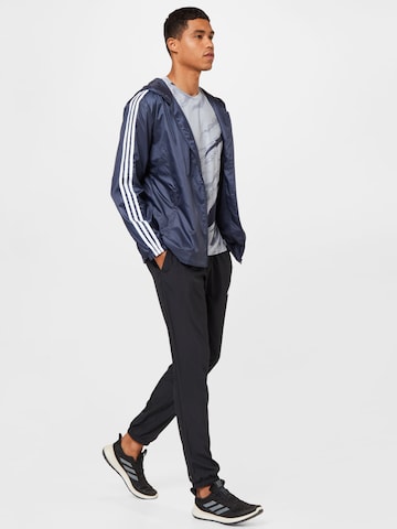 ADIDAS ORIGINALS - Chaqueta de entretiempo en azul