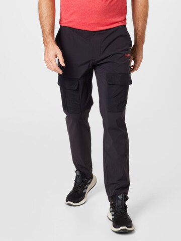 Tapered Pantaloni cu buzunare 'Adventure' de la ADIDAS ORIGINALS pe negru: față