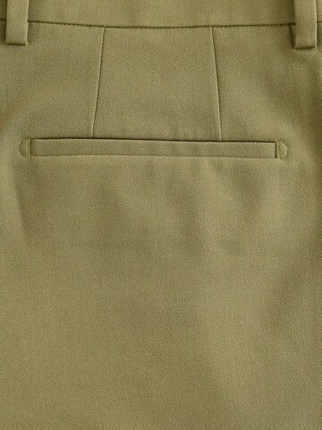 Skinny Pantalon à plis Next en vert