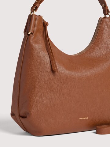 Coccinelle Handtas 'COCCINELLE REBEKKA 4' in Bruin