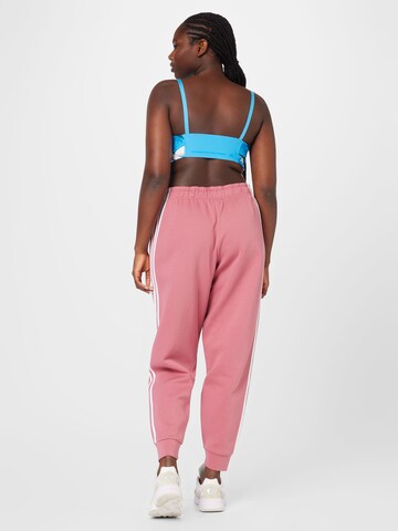ADIDAS SPORTSWEAR Zwężany krój Spodnie sportowe 'Future Icons 3-Stripes  ' w kolorze różowy