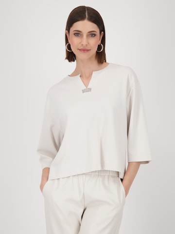 Tricou de la monari pe bej: față
