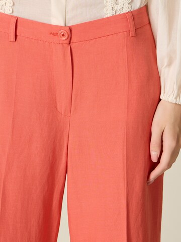 oltre - Tapered Pantalón en naranja