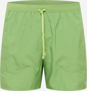 NIKE Sports trousers 'STRIDE' in Green: front