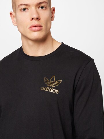 Maglietta 'Golden Chains - 50 Years Of Trefoil' di ADIDAS ORIGINALS in nero