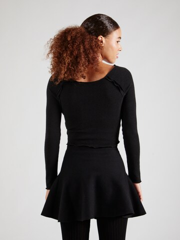 STUDIO SELECT - Camiseta 'Mona' en negro