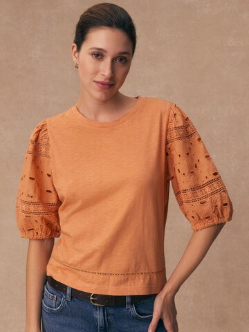 Next T-Shirt in Orange: Vorderseite