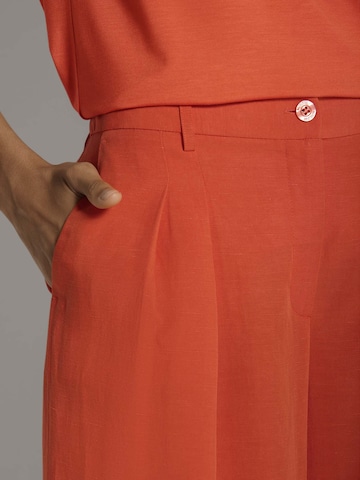 MADELEINE Loosefit Bandplooibroek in Oranje