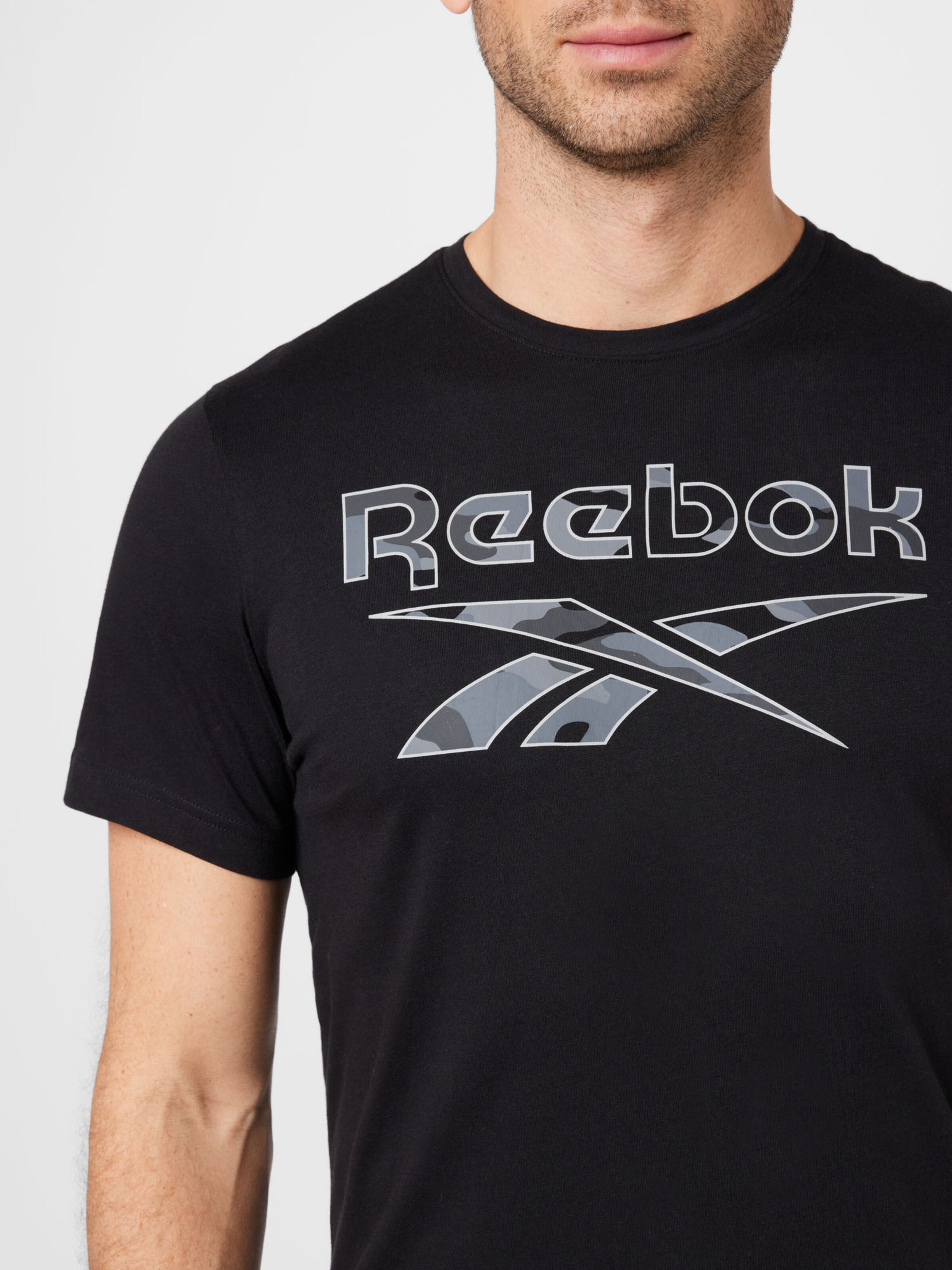 Homme T-Shirt fonctionnel Reebok Sport en Noir 