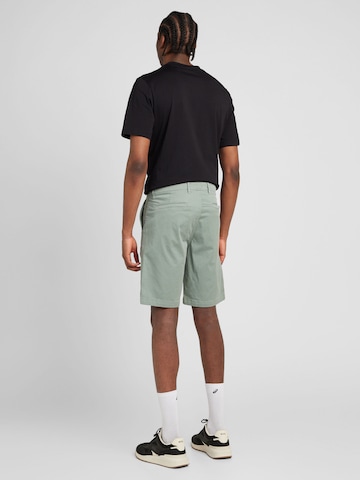 Slimfit Pantaloni eleganți de la BOSS Orange pe verde