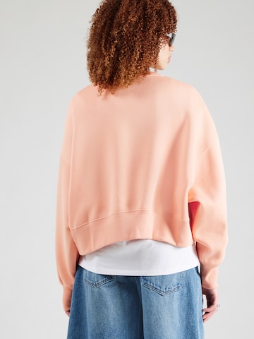Nike Sportswear - Sudadera 'Phoenix Fleece' en naranja