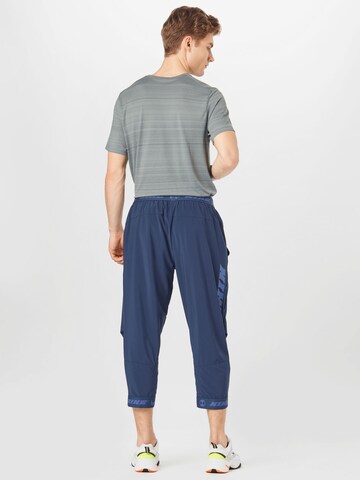 NIKE Tapered Sportbroek in Blauw