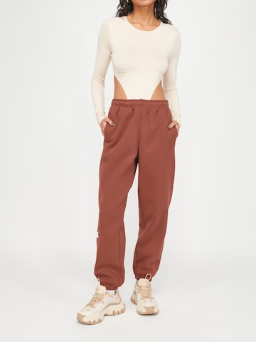 ABOUT YOU x VIAM Studio Regular Pants 'Motivation' in Brown: front