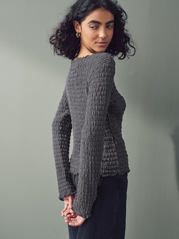 Next Pullover in Grau