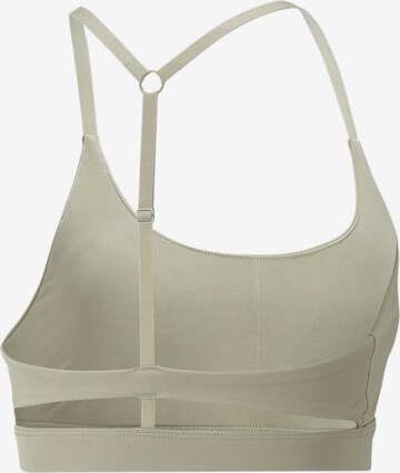 Bustino Reggiseno sportivo di PUMA in verde