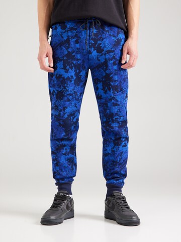 mėlyna Nike Sportswear Siaurėjantis Kelnės 'TCH FLC': priekis