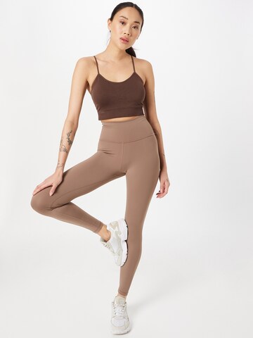 Athlecia Skinny Sports trousers 'GABY' in Brown