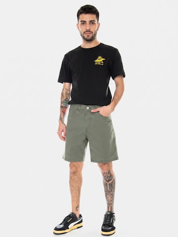 Baggy Pantaloni 'Newel Short Dollar Green' di Carhartt WIP in verde