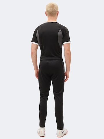 Coupe slim Pantalon de sport 'TeamLIGA26' PUMA en noir