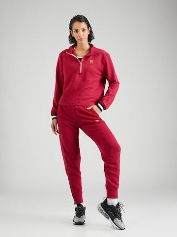 Effilé Pantalon de sport NIKE en rouge