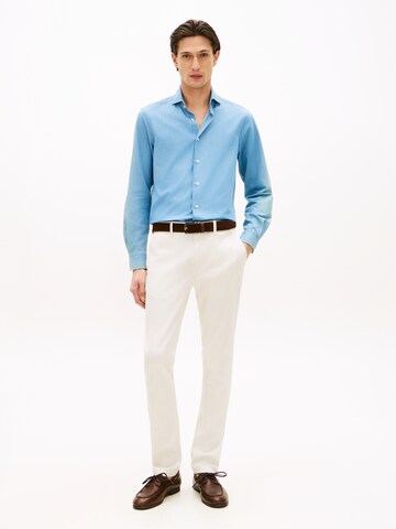 TOMMY HILFIGER Slimfit Housut värissä keltainen