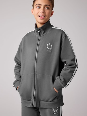 smALLSAINTS - Sudadera con cremallera en gris: frente