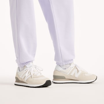 Tapered Pantaloni 'Sport Essentials French Terry Jogger' di new balance in lilla