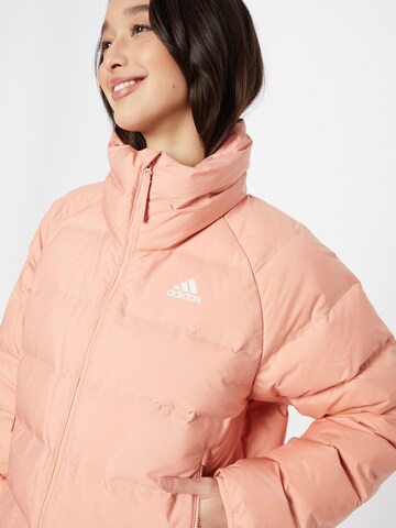 ADIDAS SPORTSWEAR - Casaco outdoor 'Helionic' em laranja