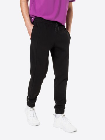 PUMA Tapered Sportbroek 'Radical' in Zwart: voorkant