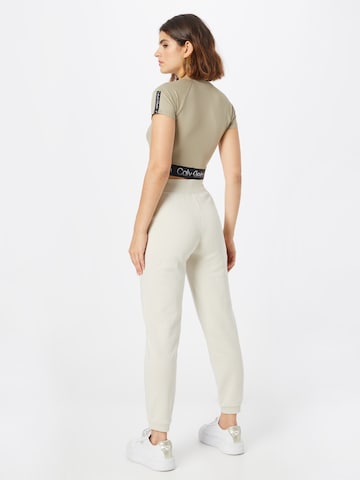 Calvin Klein Sport Дънки Tapered Leg Панталон в бежово