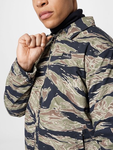 BDG Urban Outfitters Between-Season Jacket 'TIGER CAMO' in Green