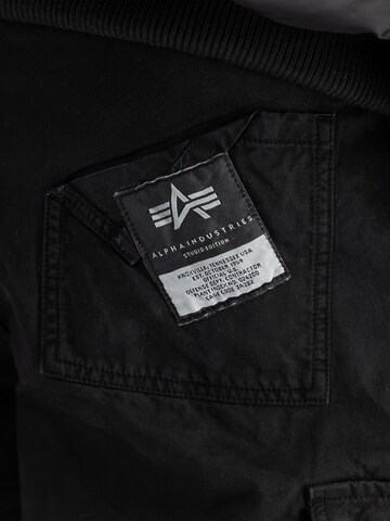 ALPHA INDUSTRIES - Loosefit Pantalón cargo en negro