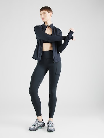 new balance Skinny Fit Спортен панталон 'Essentials' в черно