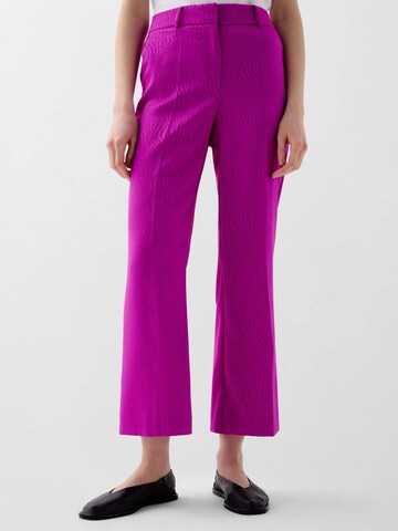 Scalpers Flared Pants in Pink: front