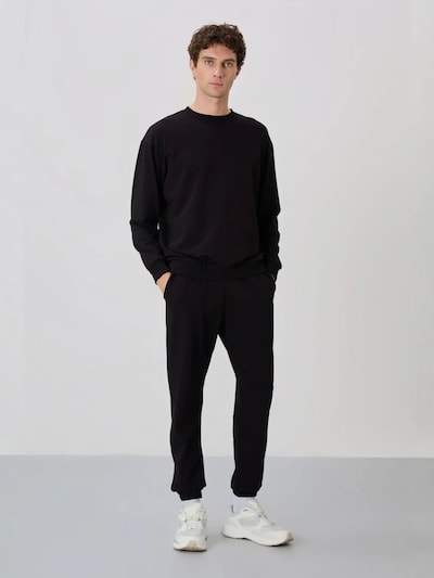Tommy Life Survêtement en L en noir, Vue avec produit